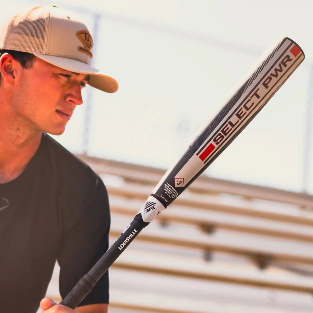 A Baseball Player Holding the 2026 Louisville Slugger Select PWR from Headbanger Sports