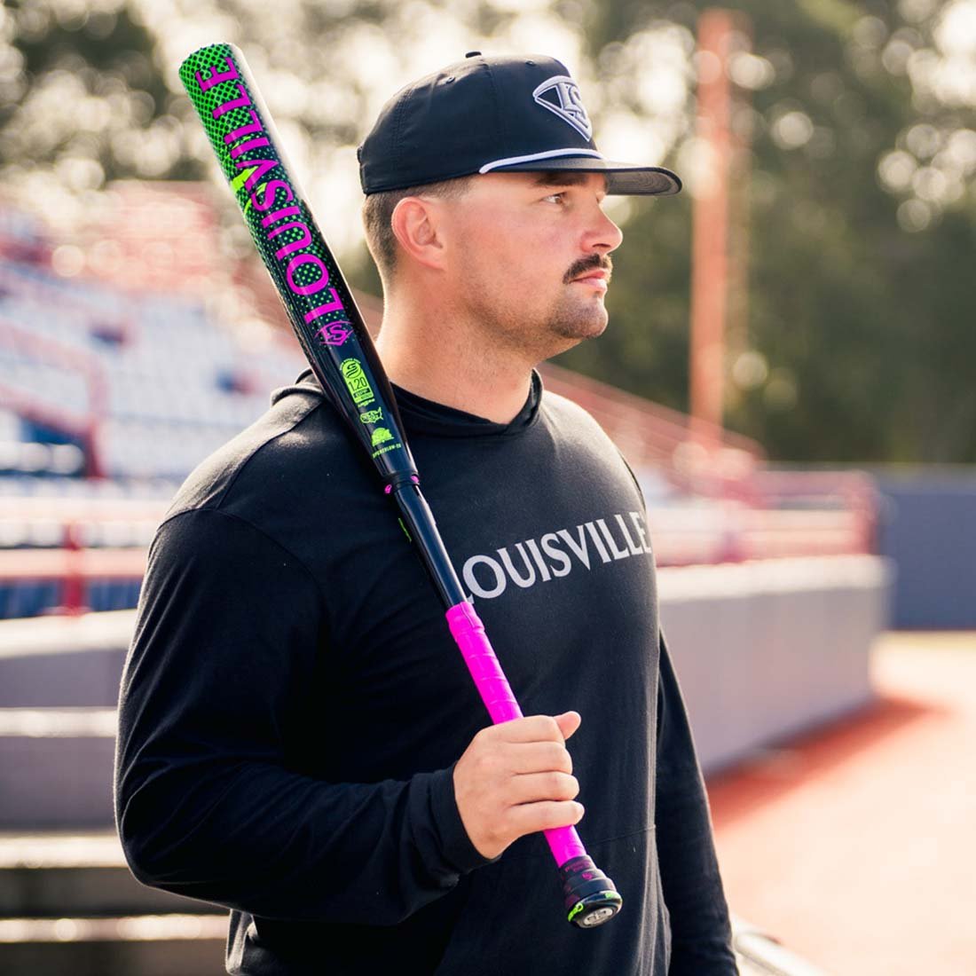 2026 Louisville Slugger Genesis Justin Lutheran 2PC Powerload USSSA slowpitch bat 13 inch barrel 1 oz endload. Justin is holding his bat at Space Coast stadium in Viera Florida