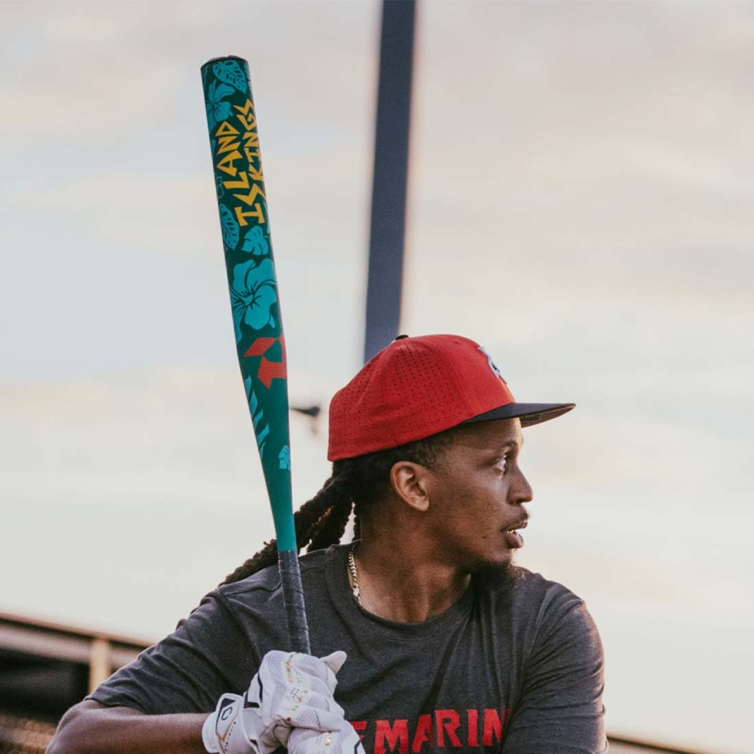 2027 DeMarini Island Kings USSSA slowpitch softball bat with 13 inch endloaded barrel held by a DeMarini Pro Player