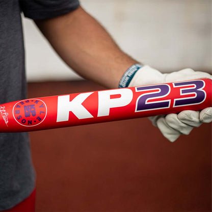 2026 Miken KP23 12.75" 1-Piece Maxload USA Bat held on a slowpitch field