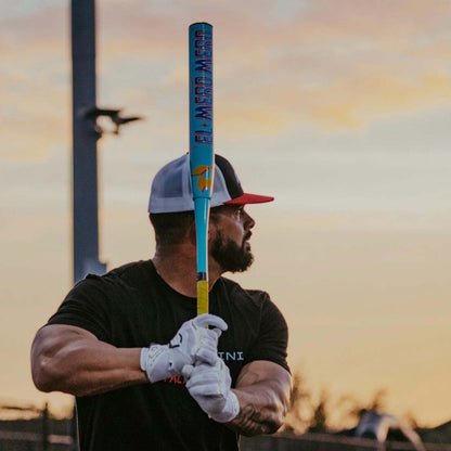 2027 DeMarini El Mero Mero USSSA slowpitch softball bat 13 inch balanced APC composite barrel held by a DeMarini Pro Player